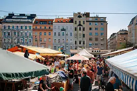 Market stalls and people standing between them