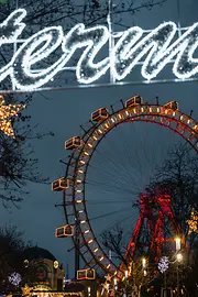 Sparkling Ferris Wheel with Christmas decorations at night