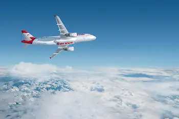 White aircraft with Austrian Airlines’ red “Servus” marking flying above the clouds