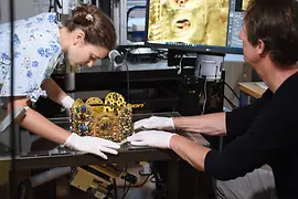 Researchers examining the crown of the Holy Roman Empire