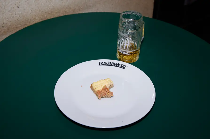 Trzesniewski, half-eaten roll, small glas of beer