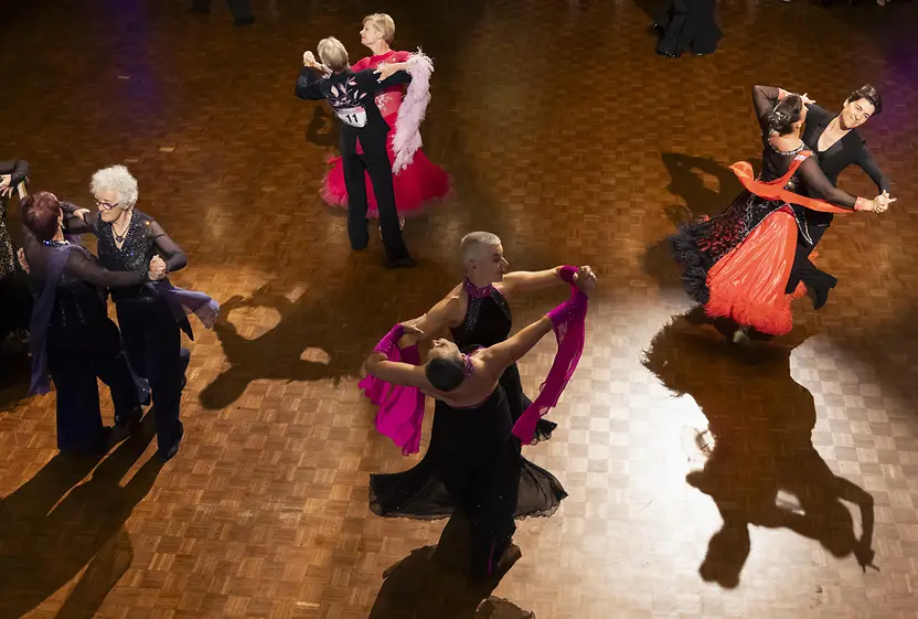 Dancing female couples in a hall at the EuroGames 2023 in Switzerland