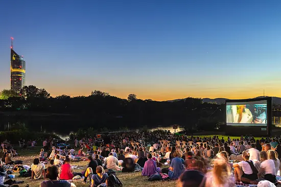 Open-air cinema in a Viennese park at night