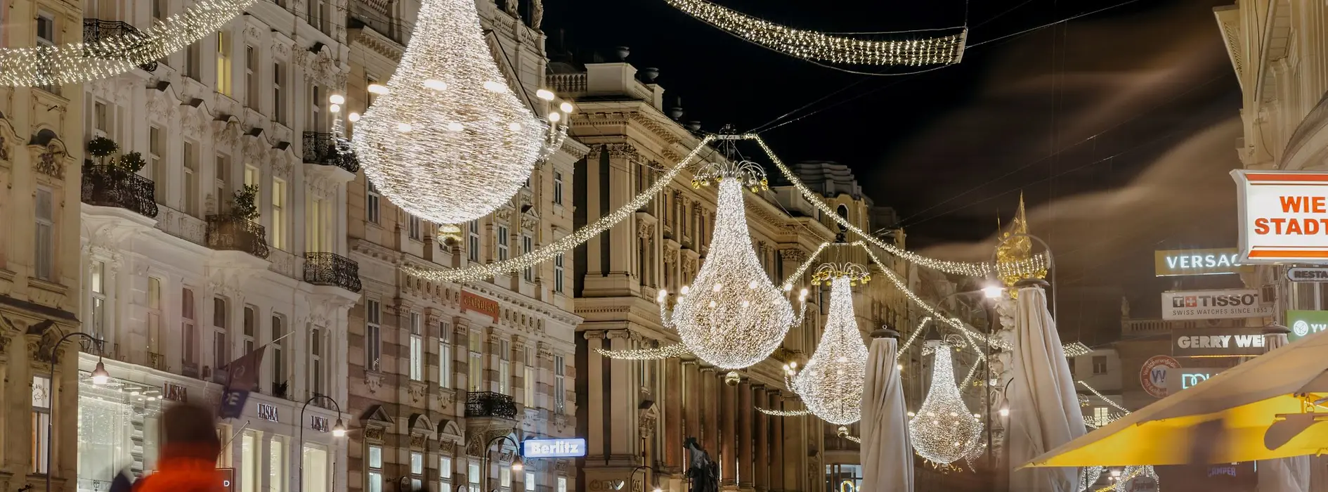 Christmas lights in the form of chandeliers on a shopping street