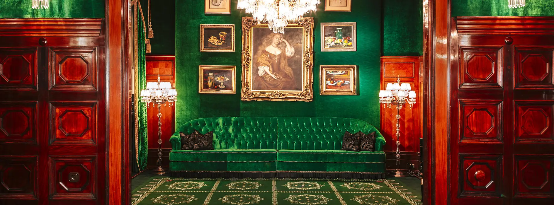 Hotel Sacher, green bench, green wall, pictures on the wall