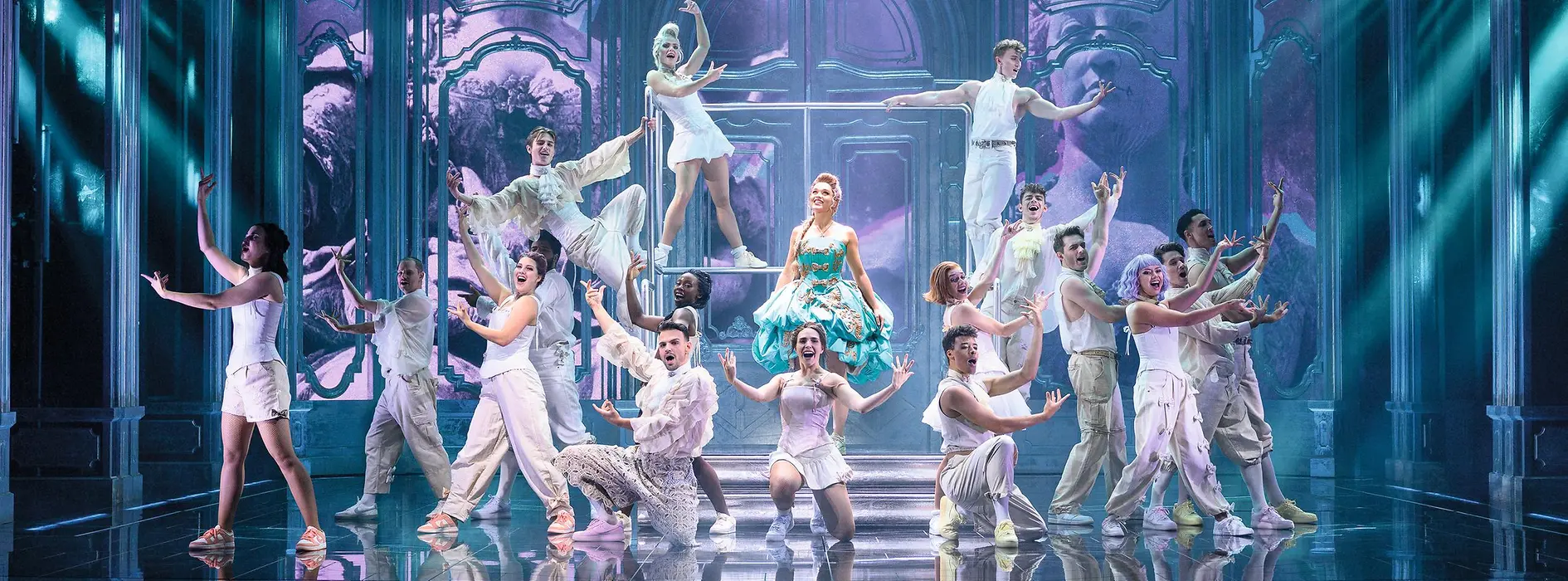 Maria Theresa in a green dress, surrounded by dancers in white costumes.