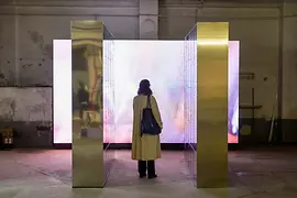 Vienna Design Week exhibition Woman in front of a glowing screen