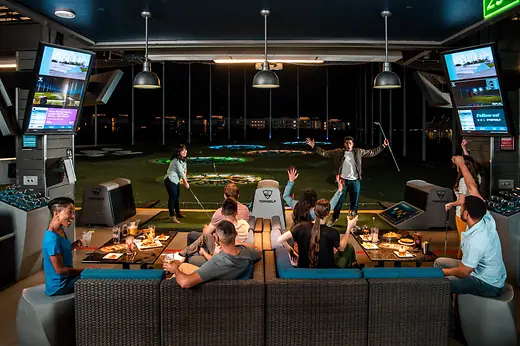Young people playing golf and partying