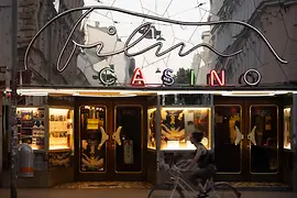 Evening view of the Filmcasino entrance in Vienna with neon lighting