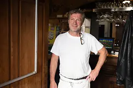 Innkeeper inside the Zum Alten Fassl restaurant in Vienna-Margareten
