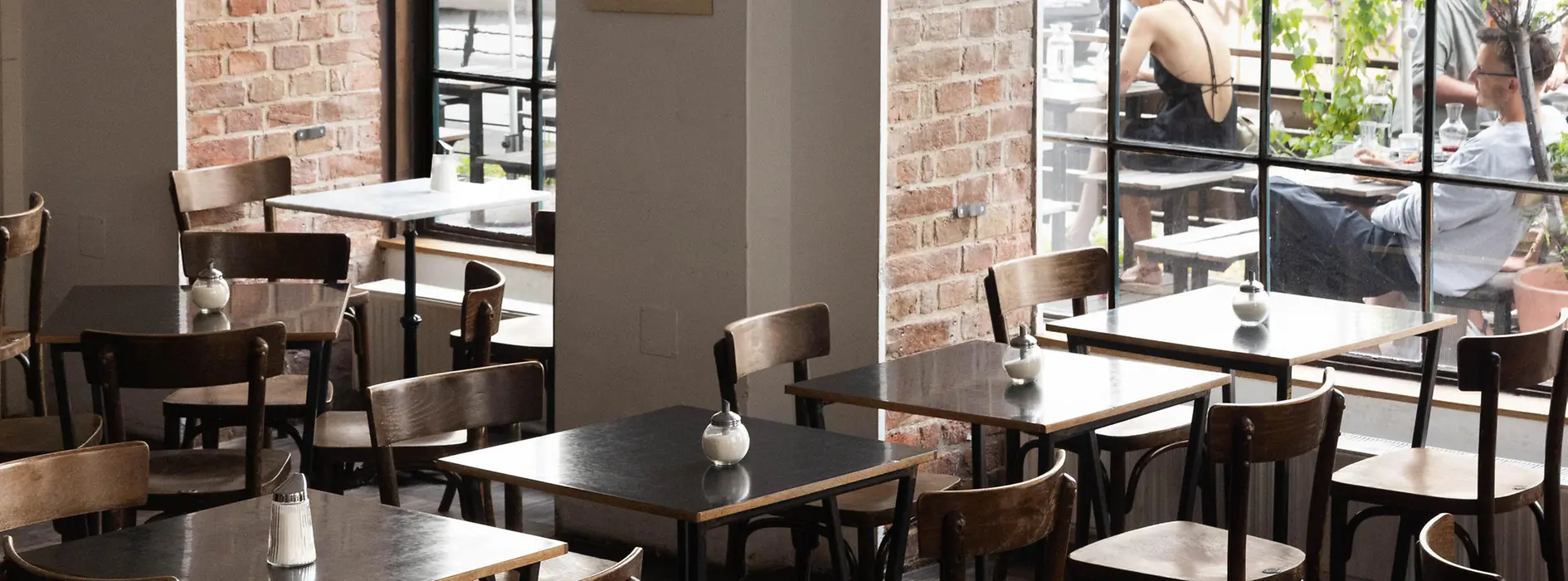 View from inside Café Propeller on Margaretenstraße in Vienna towards the outdoor seating area
