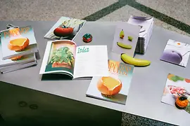 Silver table with colorful magazines